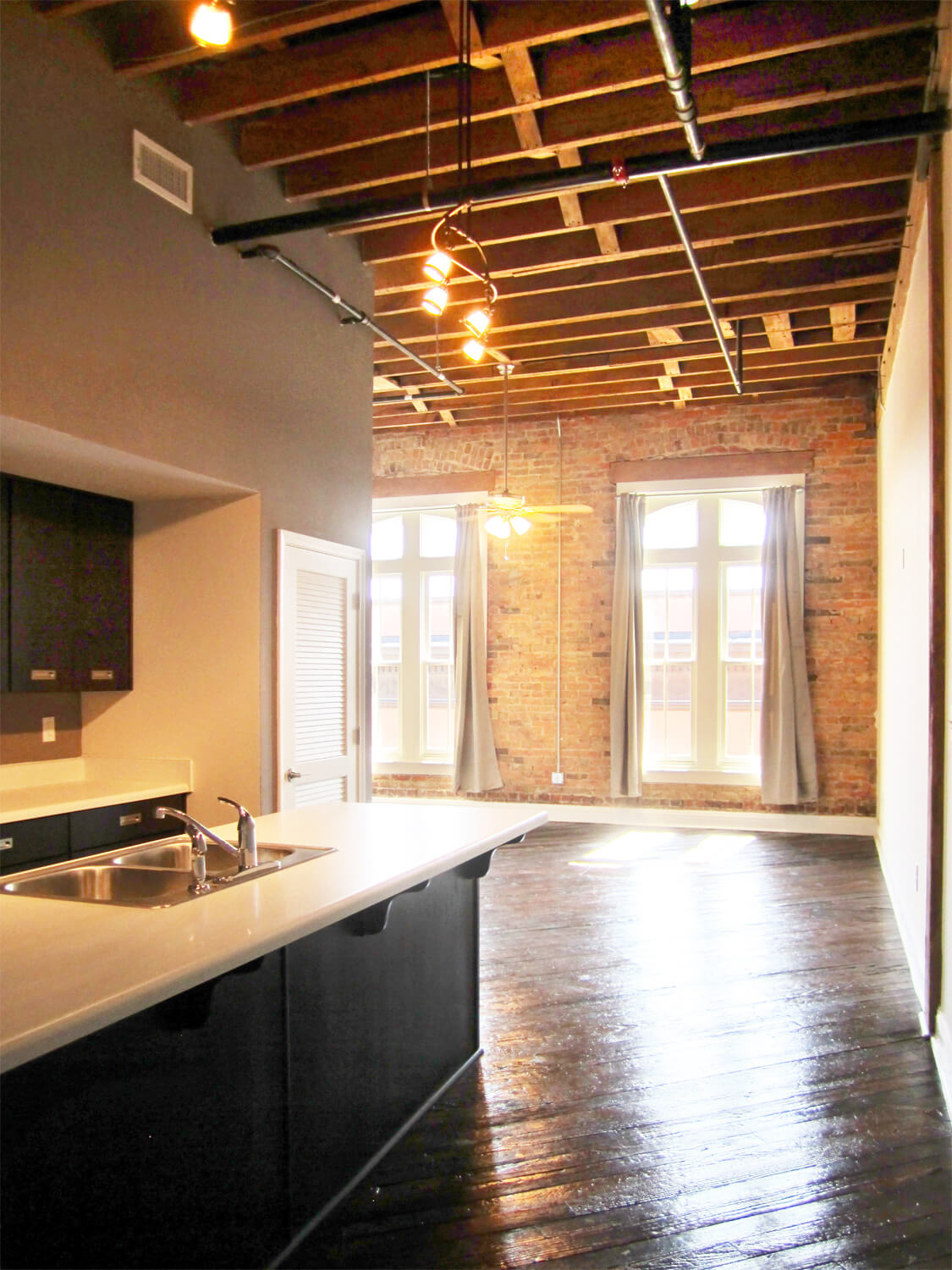 Printing Press Lofts Designed by Foshee Architecture - Interior View of Apartment with an Exposed Wood Ceiling