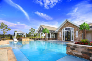 The Morgan Apartments Clubhouse Designed by Foshee Architecture - View of Pool Looking Towards the Clubhouse