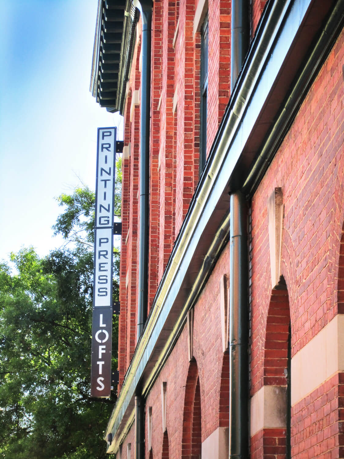 Printing Press Lofts Designed by Foshee Architecture – Exterior Blade Sign