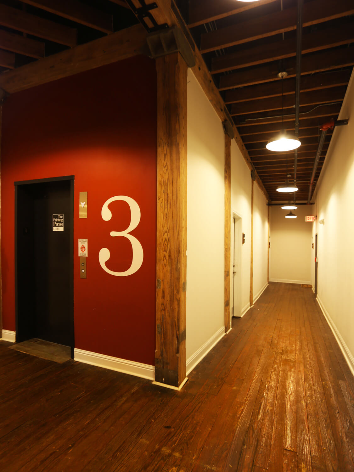 Printing Press Lofts Designed by Foshee Architecture – View of Third Floor Elevator Lobby